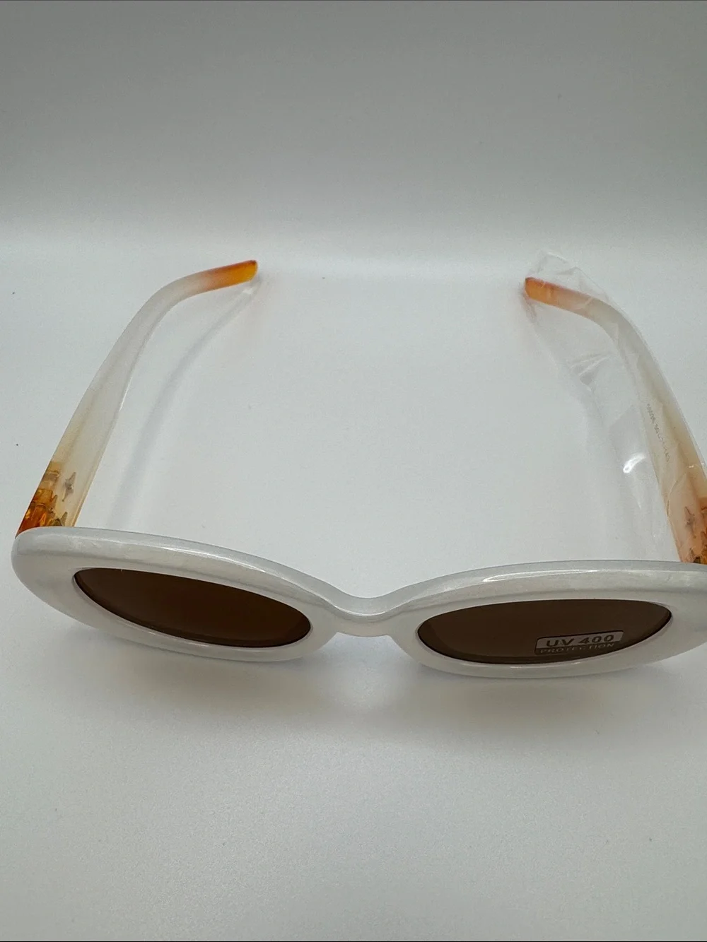White Oval Sunglasses with Brown Lenses